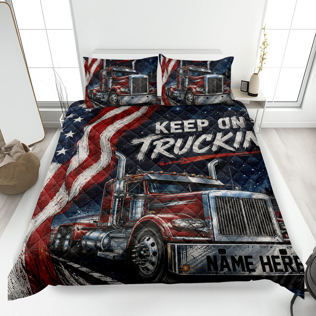 Patriotic trucker quilt blanket displayed on a bed with red semi-trucks and bold navy artwork
