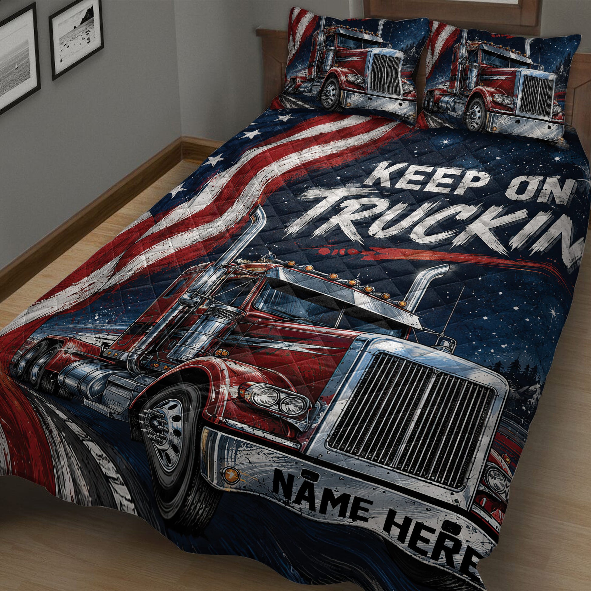 Close-up of a trucker quilt blanket featuring red semi-trucks, stars, and bold red, white, and blue graphics