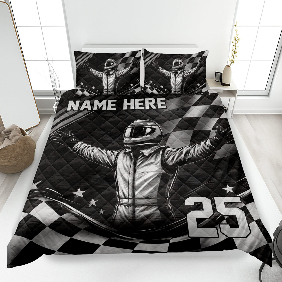 Racing quilt blanket displayed on a bed with helmeted driver artwork, checkered flags, stars, and monochrome styling