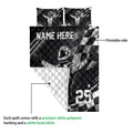 Racing quilt blanket detail showing printed driver artwork, checkered flag pattern, and quilted white backing