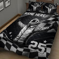 Motorsport quilt blanket shown on a bed with dramatic helmeted driver artwork and black and white racing graphics