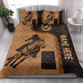 Western barrel racing quilt bedding styled in a bright bedroom with horse and rider artwork