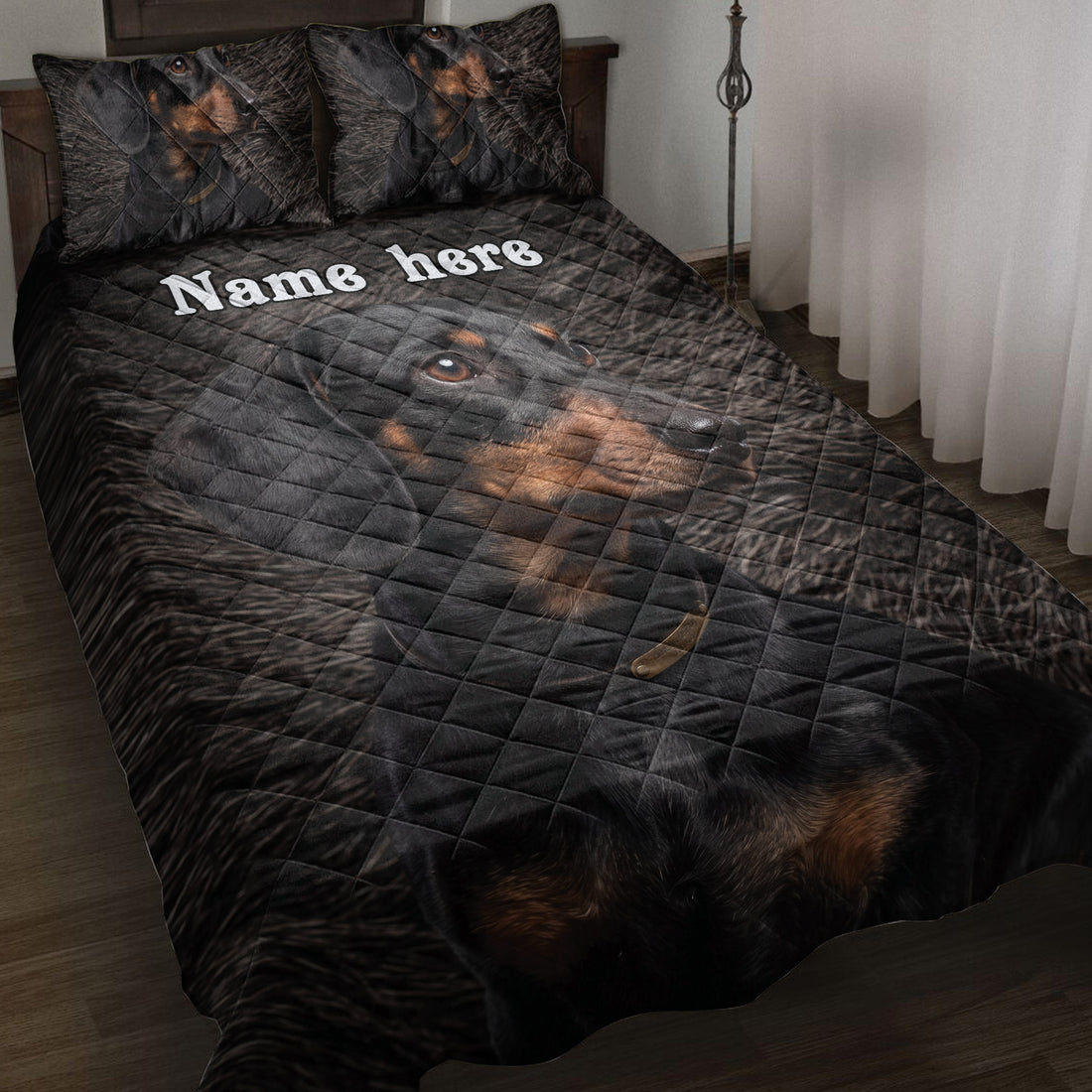 Black and tan dachshund quilt blanket displayed on a bedroom bed with coordinating dog artwork