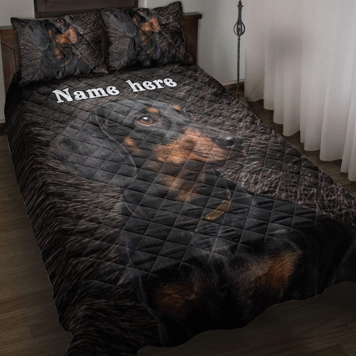 Black and tan dachshund quilt blanket displayed on a bedroom bed with coordinating dog artwork