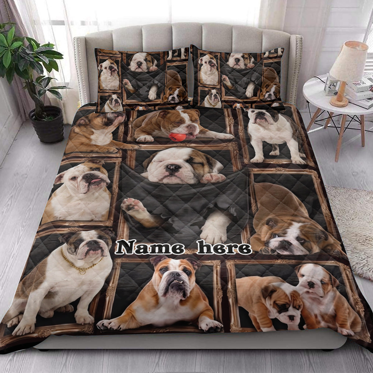 English Bulldog quilt blanket styled on a bedroom bed with multiple bulldog portraits and dark framed artwork