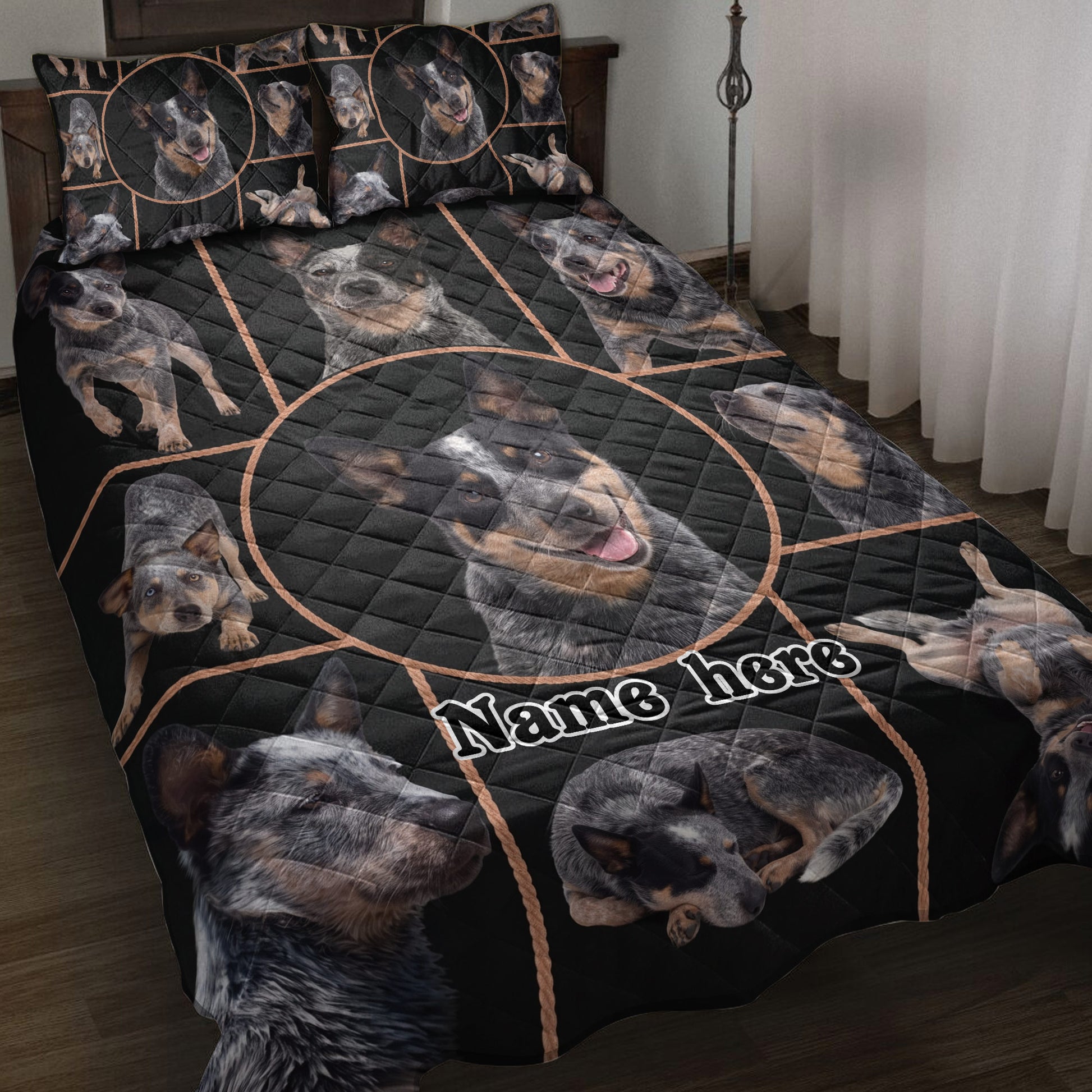Australian Cattle Dog quilt blanket displayed on a bed with black geometric artwork and multiple dog portraits