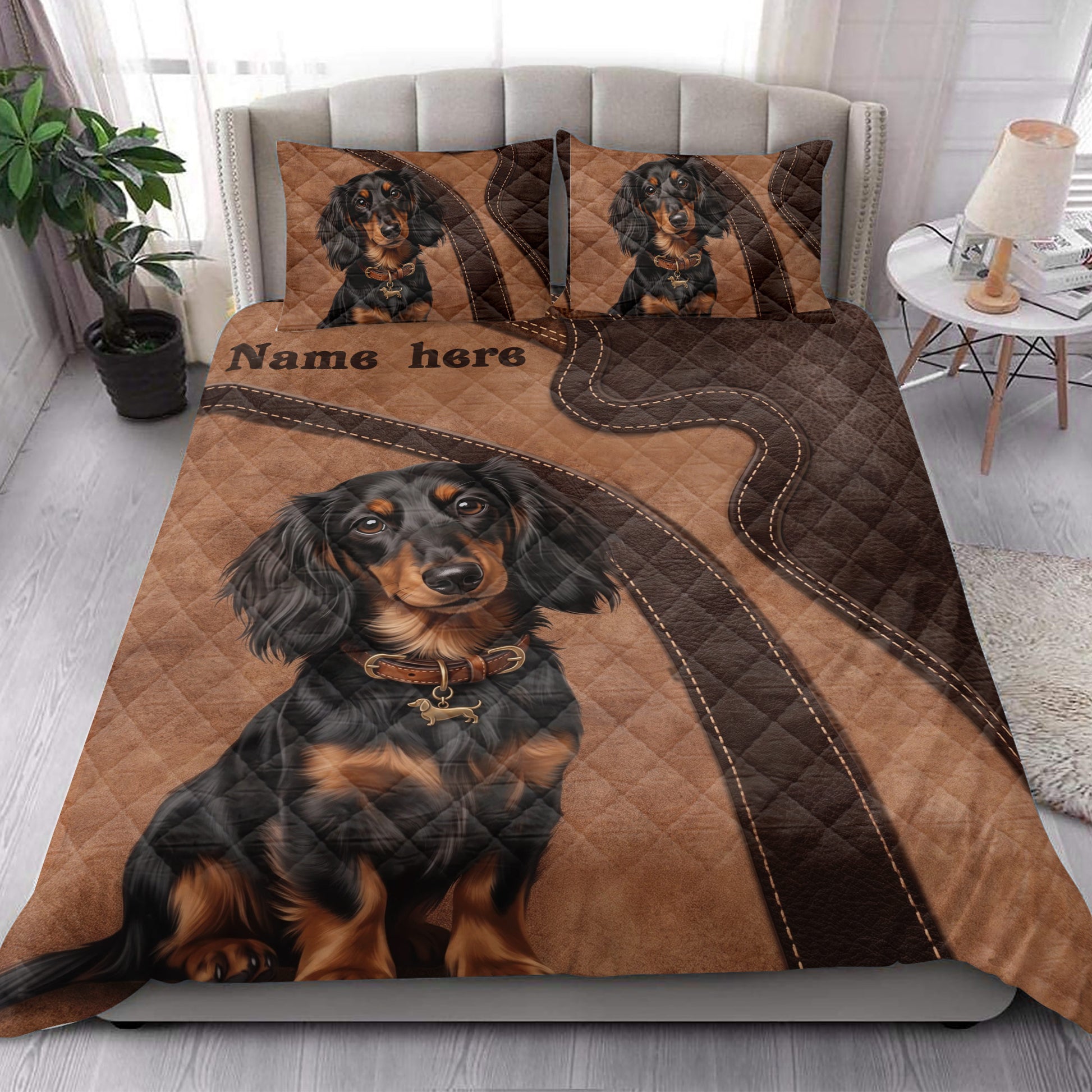 Dachshund quilt blanket styled on a bedroom bed with dog artwork and brown patchwork accents