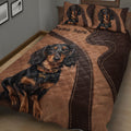 Close bedroom view of a dachshund quilt blanket with multiple black and tan dogs
