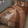 Close bedroom view of a brown Chihuahua quilt with large expressive dog portraits