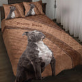 American Staffordshire dog quilt blanket styled on a bed with matching dog artwork and brown leather-inspired accents