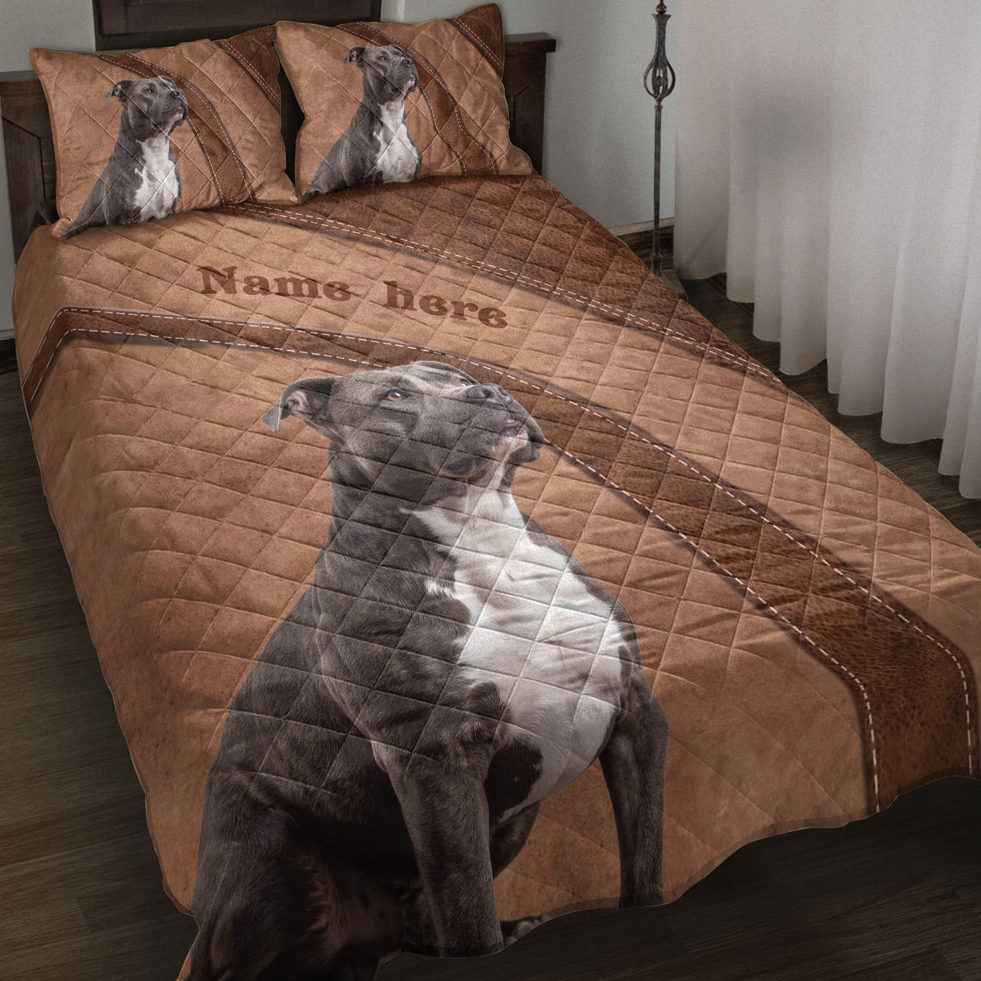 American Staffordshire dog quilt blanket styled on a bed with matching dog artwork and brown leather-inspired accents