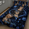 Yorkshire Terrier quilt blanket displayed on a bed with multiple dogs and dramatic blue floral details