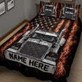 Close angled view of a fiery semi truck quilt blanket with bold black, silver, orange, and star artwork