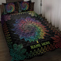 Black sunflower quilt blanket with vibrant rainbow petals, peacock feather motifs, and bedroom styling