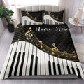 Piano-themed quilt bedding styled in a bright bedroom with black, white, and gold musical artwork