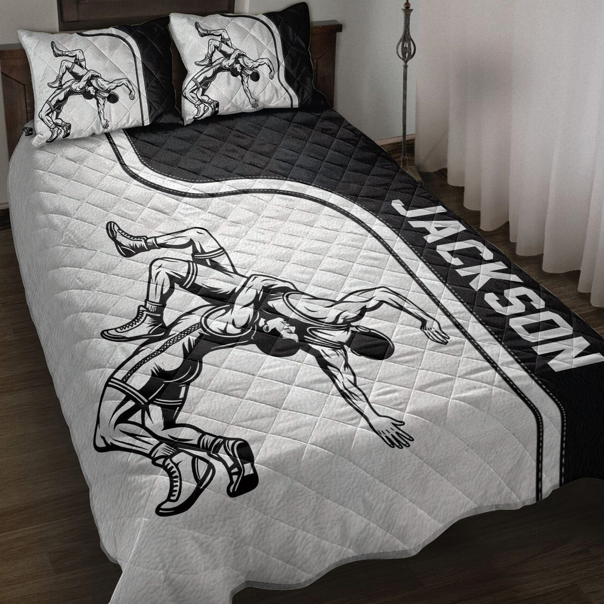 Wrestling quilt blanket displayed on a bed with black and white wrestler artwork