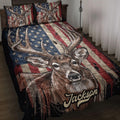Deer hunting quilt blanket displayed on a bed with patriotic stars and stripes artwork