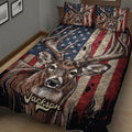 Close bedroom view of a deer and antler hunting quilt blanket in rustic red and navy tones