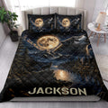 Wolf quilt bedding set styled on a bed with howling wolves, full moon, mountains, and lake scenery
