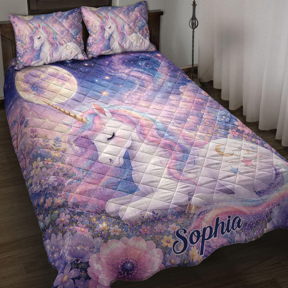 Unicorn quilt blanket spread across a bed with pastel flowers, stars, moonlight, and dreamy galaxy artwork