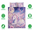 Pastel unicorn quilt bedding set shown with floral galaxy artwork and soft breathable product features