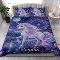 Fantasy unicorn quilt bedding displayed in a bright bedroom with moonlit flowers, butterflies, and dreamy blue artwork