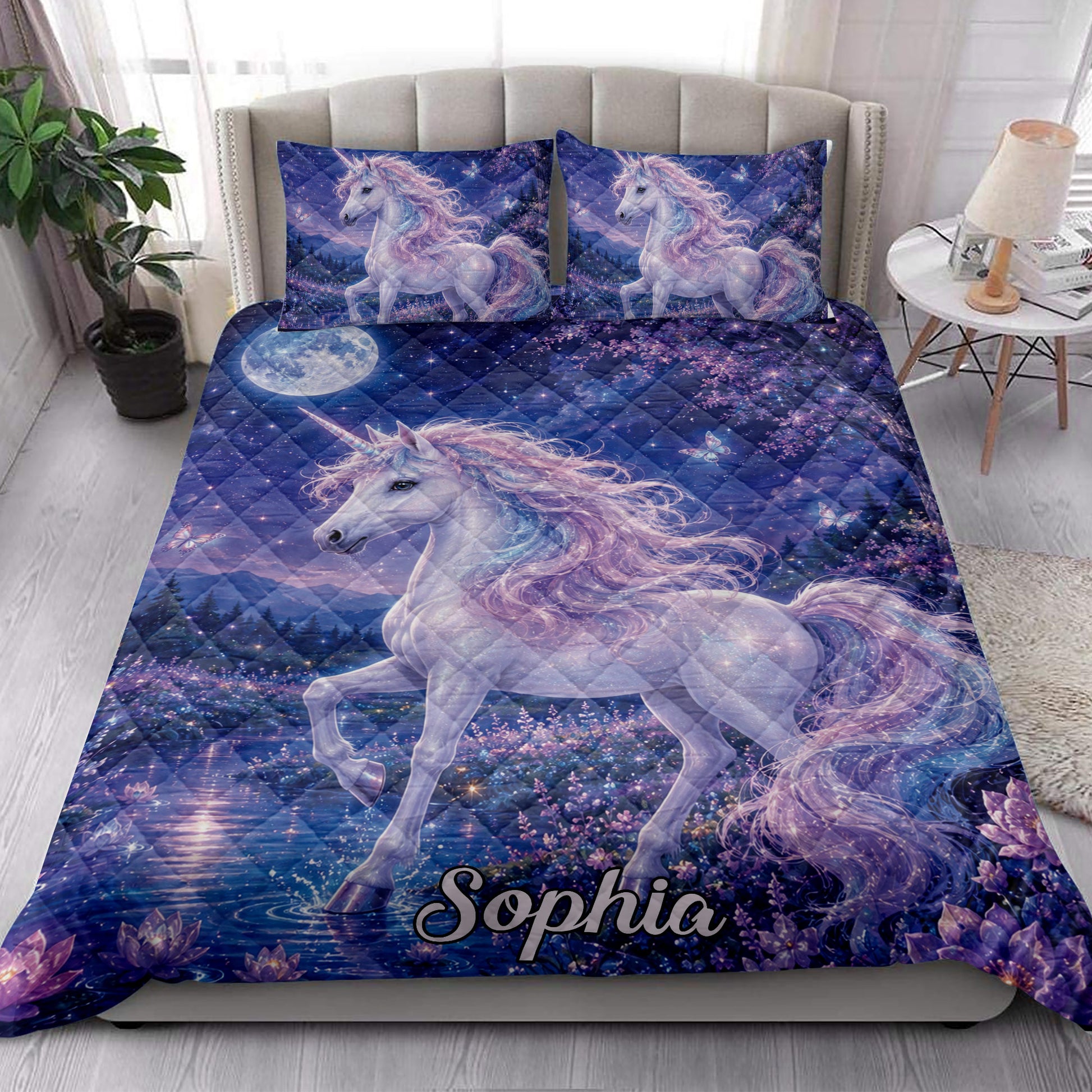 Fantasy unicorn quilt bedding displayed in a bright bedroom with moonlit flowers, butterflies, and dreamy blue artwork