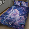 Close bedroom view of a unicorn quilt featuring a luminous white unicorn, flowers, moonlight, and starry scenery
