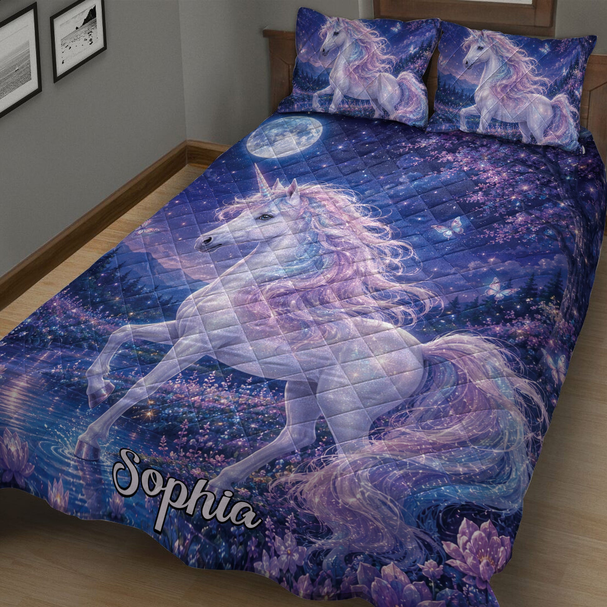 Close bedroom view of a unicorn quilt featuring a luminous white unicorn, flowers, moonlight, and starry scenery