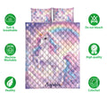 Unicorn quilt bedding display with pastel rainbow artwork and product feature icons