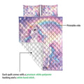Unicorn quilt blanket showing the printed front and quilted white backing detail
