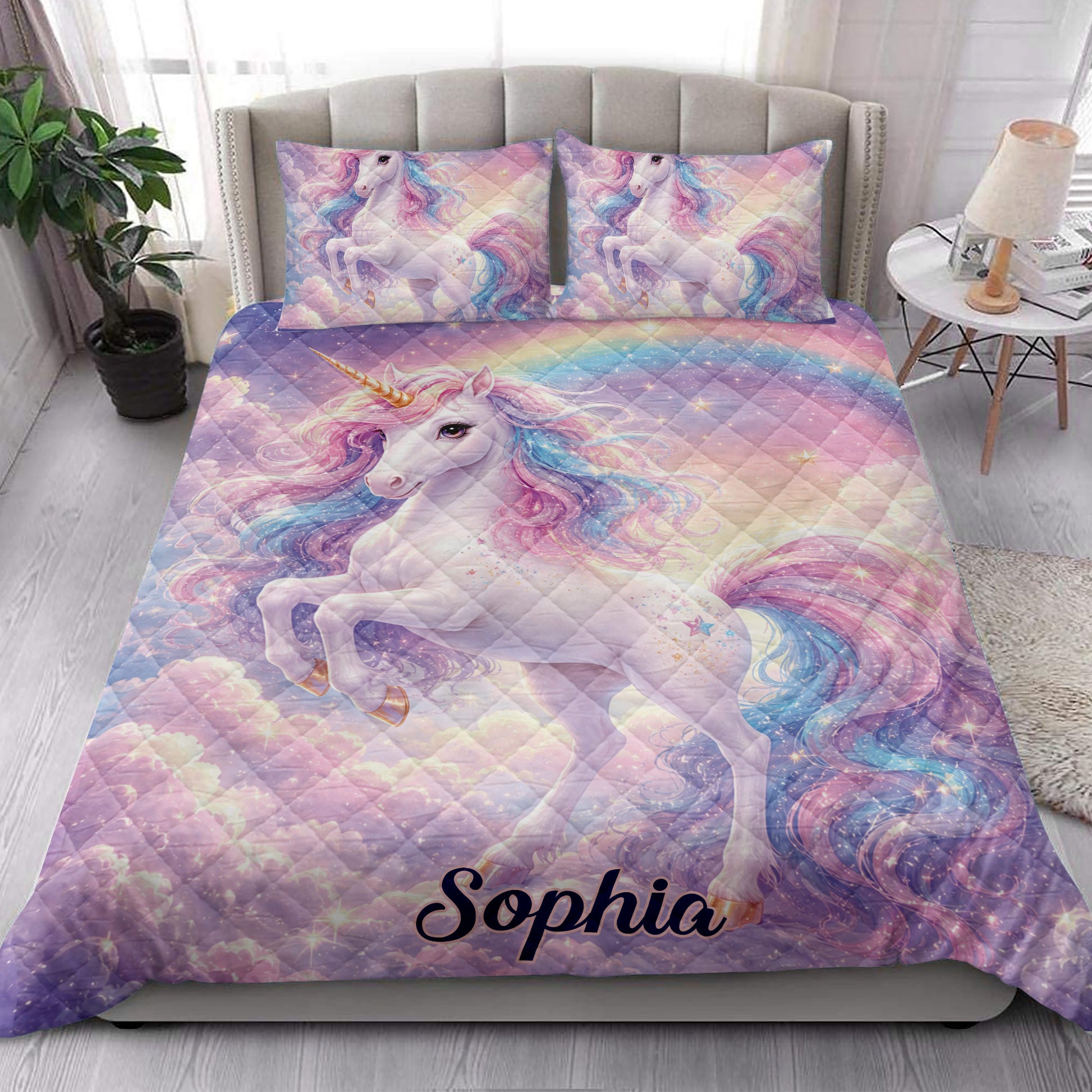 Pastel unicorn quilt bedding styled in a bright bedroom with colorful rainbow artwork