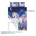 Unicorn quilt bedding set showing the printed front and white quilted backing with a floral, moonlit design