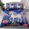 Unicorn quilt blanket styled in a bright bedroom with colorful unicorns, flowers, stars, and navy blue artwork