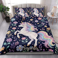 Unicorn quilt bedding set styled in a bright bedroom with matching floral rainbow artwork