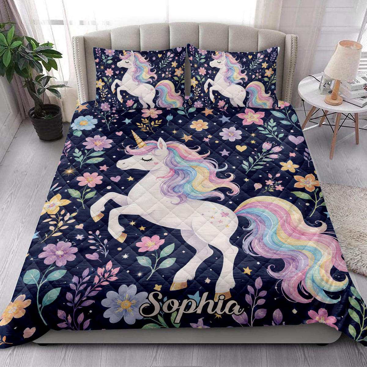 Unicorn quilt bedding set styled in a bright bedroom with matching floral rainbow artwork