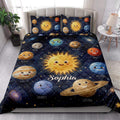 Space quilt bedding displayed on a bed with smiling planets, stars, galaxies, and a bright solar system design