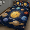Astronaut-inspired quilt blanket in a bedroom with colorful planets, stars, galaxies, and solar system artwork