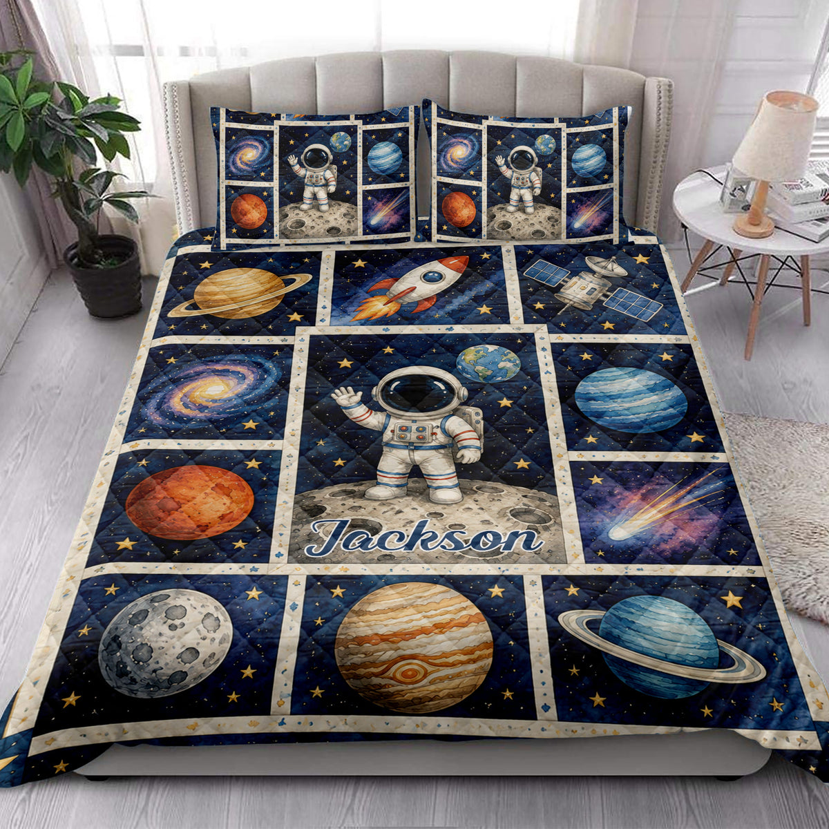 Astronaut quilt bedding styled in a bright bedroom with planets, rockets, and galaxy panels