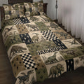 Dinosaur quilt blanket displayed on a bed with vintage patchwork artwork in olive green, tan, and black