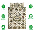 Dinosaur quilt bedding set shown front-facing with detailed prehistoric artwork and illustrated product feature icons