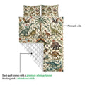 Dinosaur quilt shown with its printed side and diamond-stitched reverse for a close-up construction view