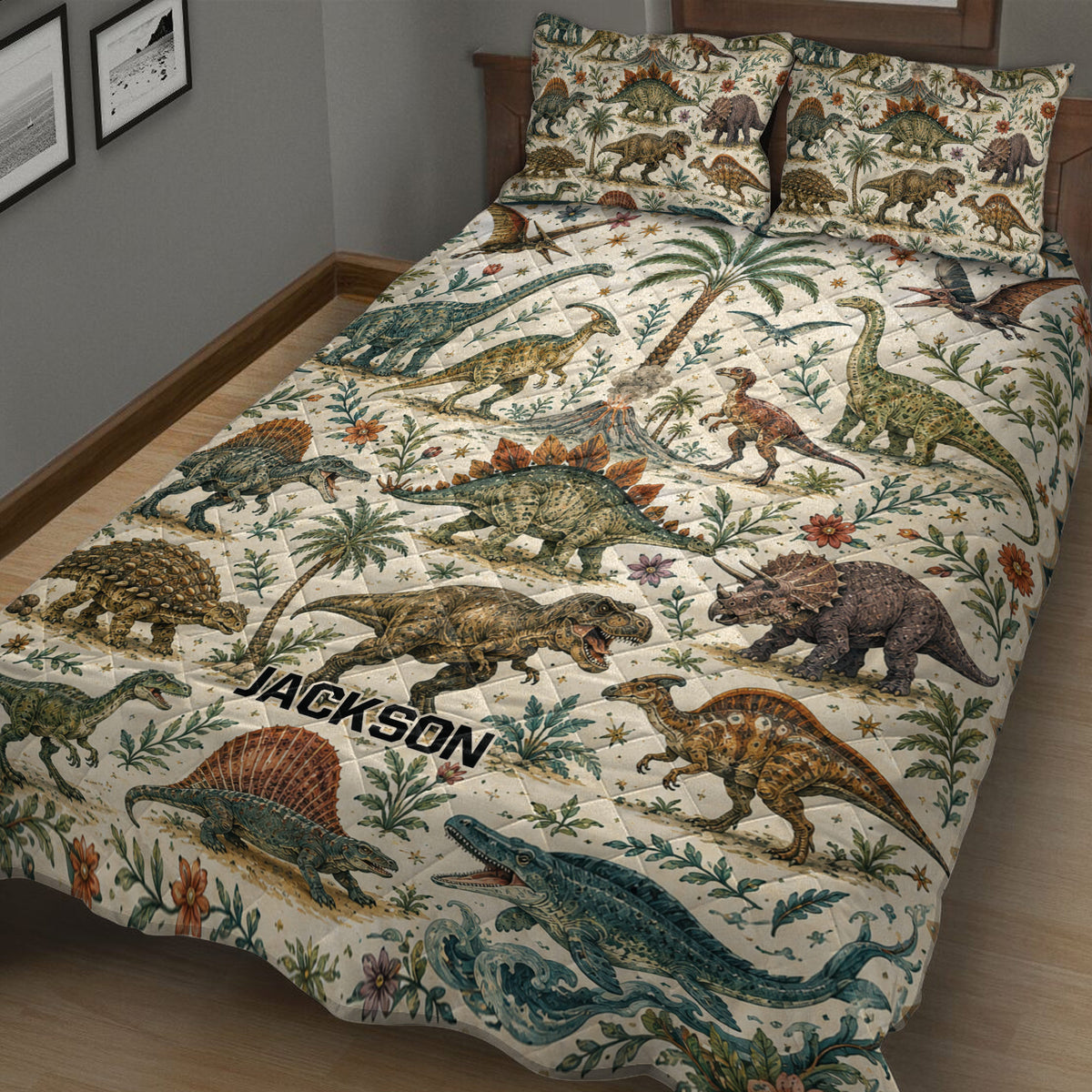 Close bedroom view of a dinosaur quilt blanket featuring realistic dinosaurs, tropical plants, flowers, and ocean artwork