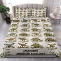Dinosaur alphabet quilt blanket styled on a bed in a bright bedroom with illustrated dinosaur rows