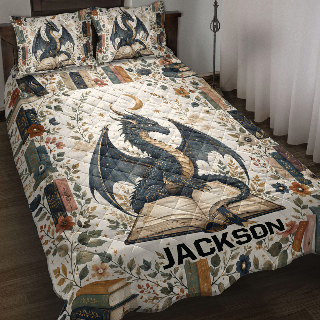 Dragon quilt blanket spread across a bed with open books, flowers, stars, and moon artwork