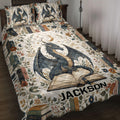 Dragon quilt blanket spread across a bed with open books, flowers, stars, and moon artwork