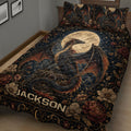 Close bedroom view of a dragon quilt blanket featuring floral details and a large moon