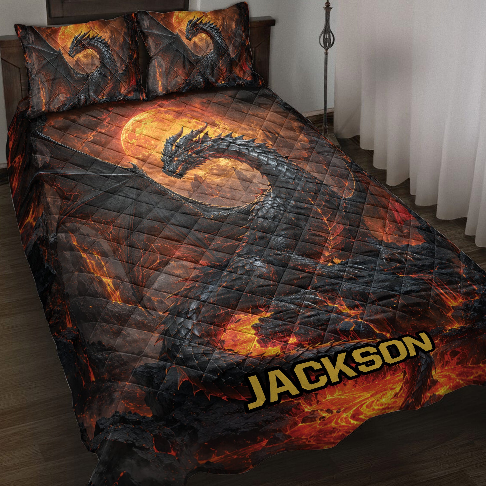 Dragon quilt bedding set displayed on a bed with black dragons, glowing lava, and fiery orange moon artwork