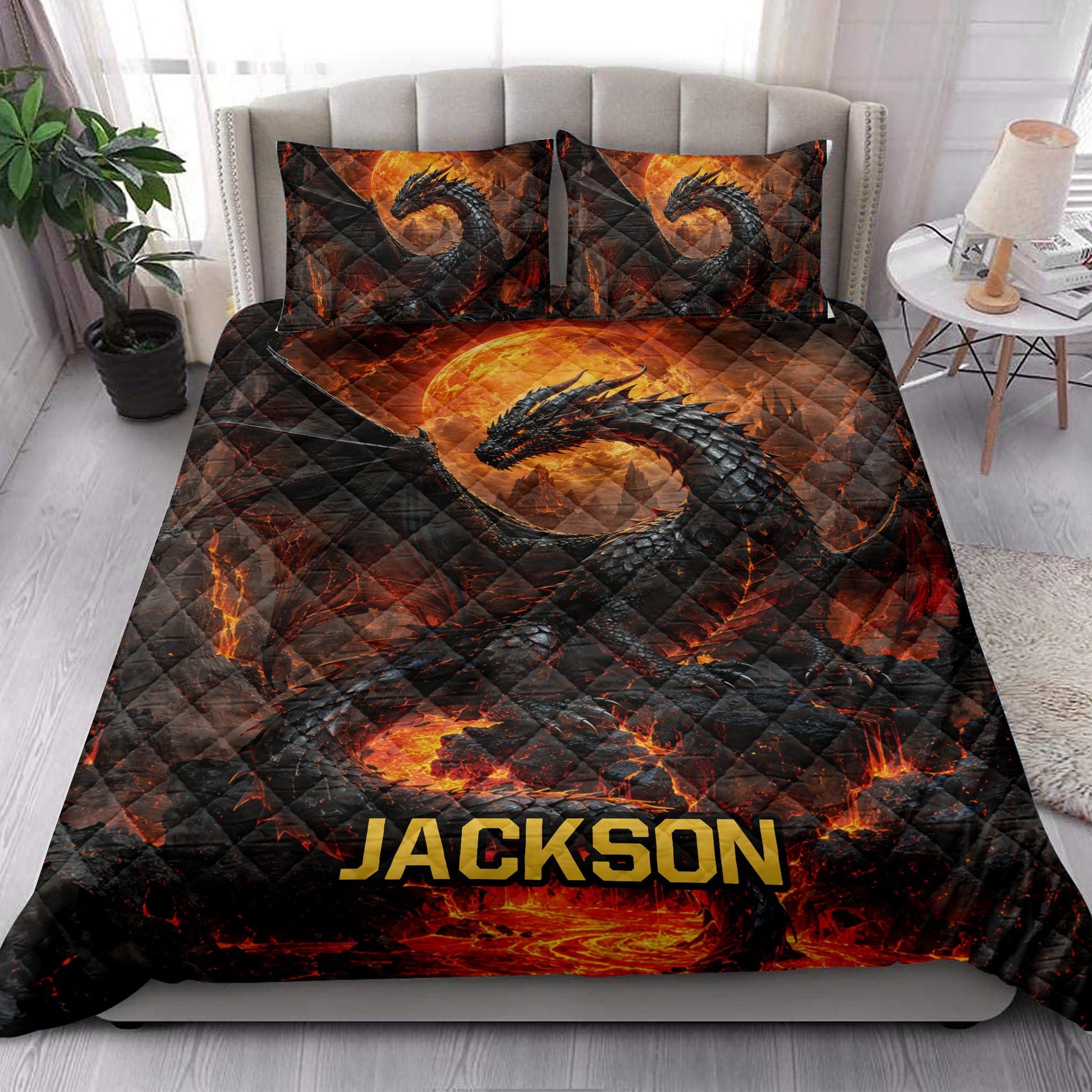 Dragon quilt bedding set styled in a bright bedroom with black dragons, lava, and glowing moon artwork