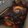 Close bedroom view of a dragon quilt blanket featuring a black dragon, volcanic landscape, and fiery colors